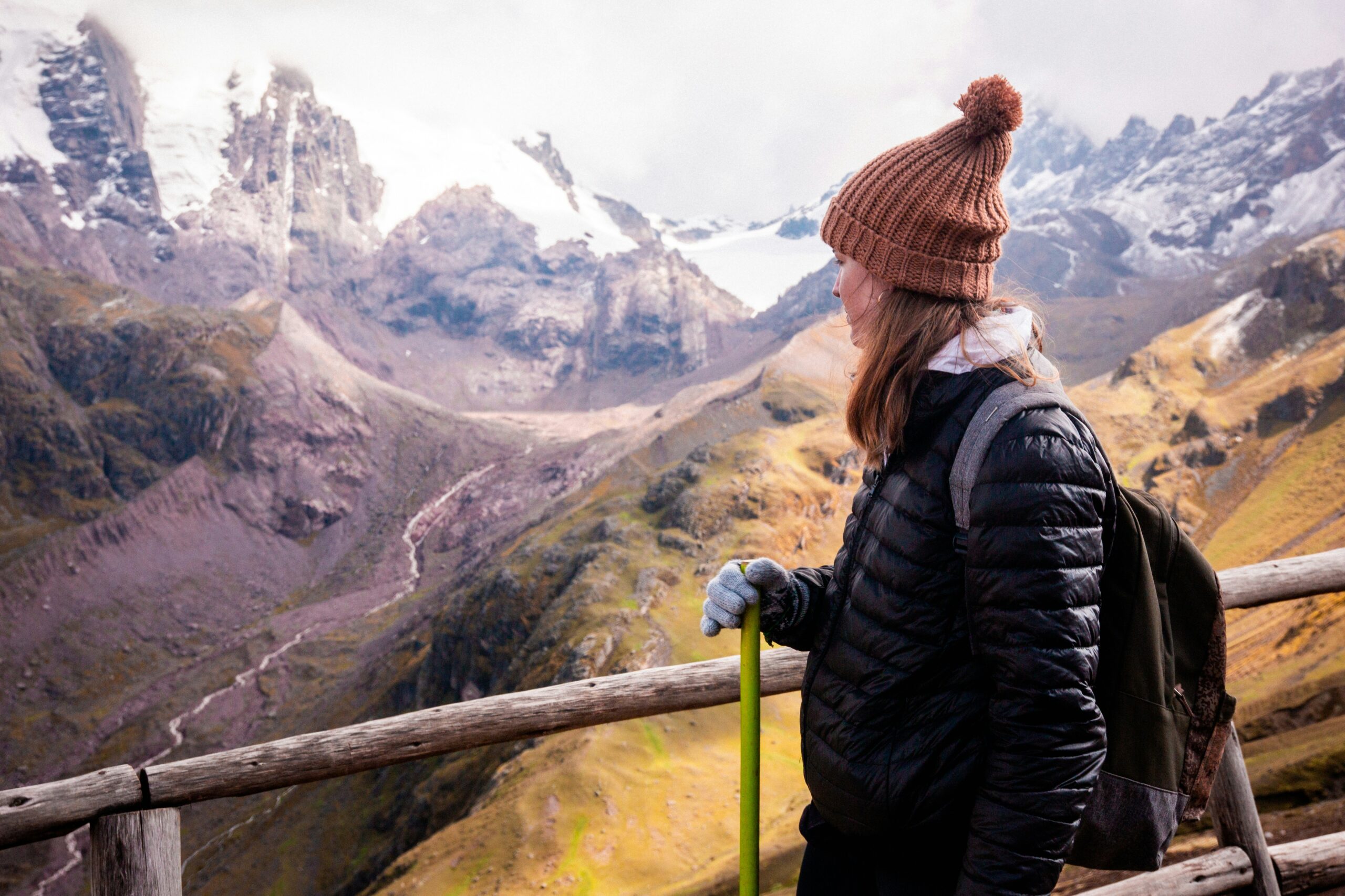 Machu Picchu travel guide: female hiker Andes mountains Peru snow peaks valley