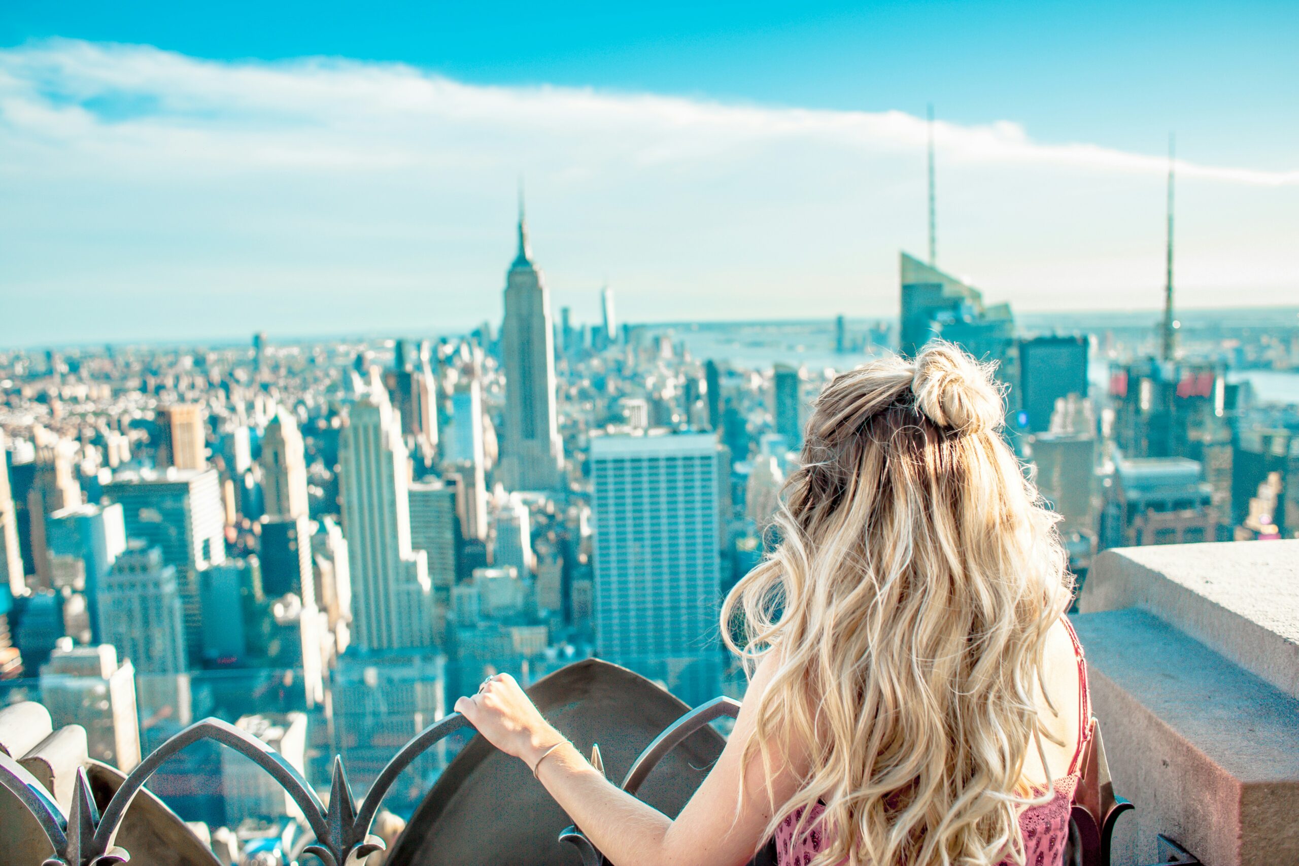 New York travel guide: Statue of Liberty Manhattan skyline One World Trade Center harbor