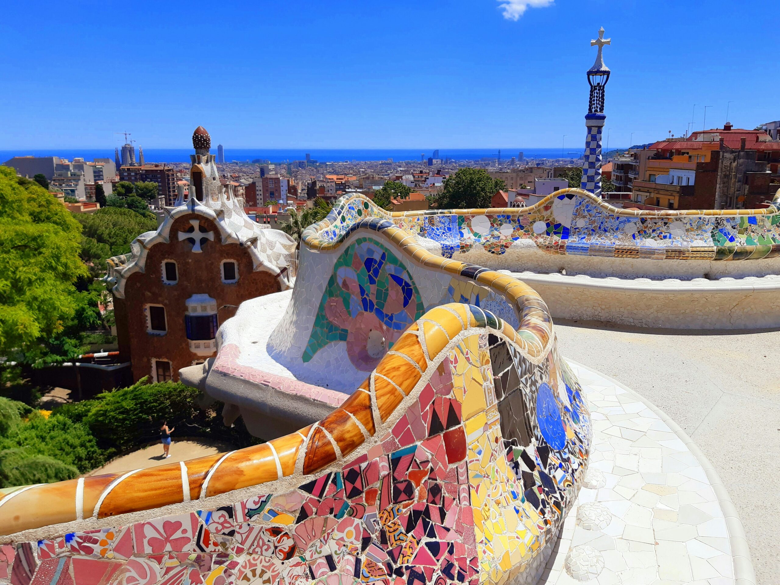 Barcelona travel guide: Park Guell Gaudi mosaic terrace colorful tile bench city view